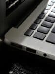 Free Detailed view of a silver laptop showing keyboard and multiple ports. Stock Photo